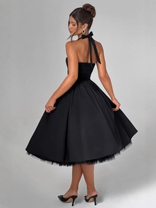 Elegant black halter neck puffy dress with backless design and A-line silhouette