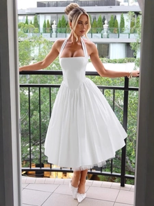 Elegant white halter neck puff dress with full skirt and mesh lining for 2025 fashion