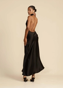 Detail view of the elegant backless design on this black satin halter evening gown