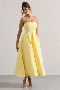 Détails de la robe de soirée bustier jaune citron avec jupe trapèze structurée élégante