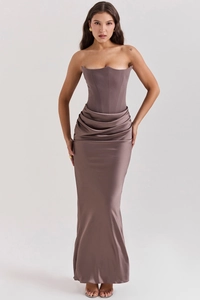 Detail of elegant satin corset dress with draped waist pleats and fishbone structure