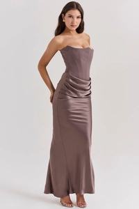 Detail of elegant satin corset dress featuring fishbone structure and waist pleats