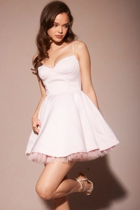 Detailed view of pink satin dress with lace trim and tiered mesh hem for a sweet look