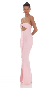 Detail view of pink bodycon maxi dress with side slit and elegant ruffle accents