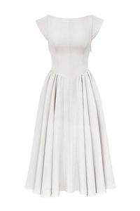 Detailed view of cream backless midi dress with bateau neckline and pleated skirt