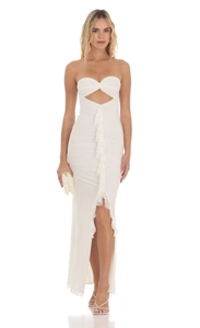 Detail of white strapless maxi dress featuring front cutout and elegant ruffled trim