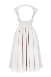 Detail of backless cut-out and pleated skirt design on this elegant midi dress