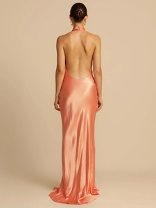 Elegant backless satin halter maxi dress in coral orange with a sexy split and flowing silhouette