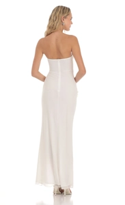 Detail of white backless bodycon dress with floral accents and invisible zipper