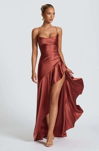 Detail of satin halter evening gown showing cowl neck and draped ruffle slit hem