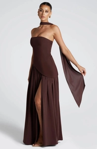 Detail of a dark brown strapless gown featuring high-waist cut and thigh-high side slit
