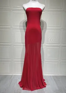 Detail of red strapless maxi dress featuring bodycon fit and elegant mesh tulle skirt