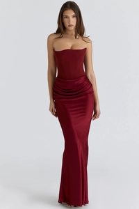 Detailed view of dark red satin floor-length dress featuring corset boning and pleated waist