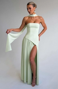 Detail of mint green strapless dress featuring a high side slit and matching neck scarf