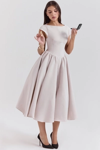 Detail of elegant champagne backless sleeveless midi dress with pleated flared skirt