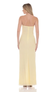 Detailed back view of a yellow strapless maxi dress featuring a sleek invisible zipper