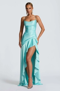 Detail of light blue satin dress with ruffled asymmetric hem and high slit design