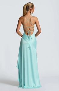 Detail of light blue satin backless dress featuring intricate criss-cross lace-up straps