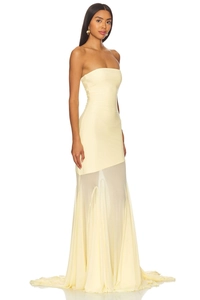 Detail of the pale yellow strapless dress with sheer mesh fishtail hem and slim fit
