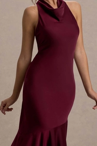 Detail of burgundy fishtail evening dress featuring elegant cowl neck and satin fabric