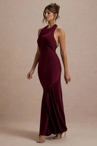 Close-up of elegant burgundy halter mermaid evening dress with sleek satin drape