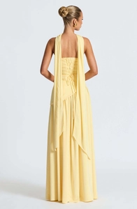 Detailed back view of light yellow lace-up back maxi dress with elegant ribbons