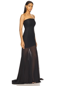 Detail of elegant black tube top maxi dress with sheer mesh panel and slight train hem