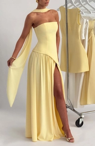 Detail of light yellow strapless gown with side high slit and matching elegant shawl
