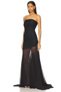 Detailed view of black strapless evening gown with sheer mesh skirt and elegant trail