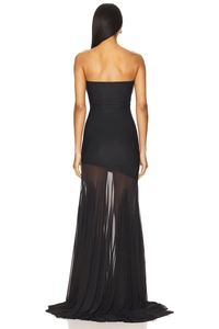 Detail of elegant black strapless evening dress with sheer pleated mesh mermaid hem
