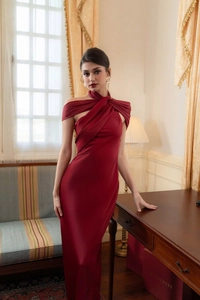 Detail of elegant burgundy satin fabric with cross halter neck and glossy texture