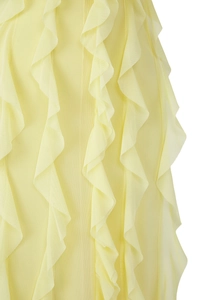 Detail of yellow tulle dress featuring tiered vertical ruffles and sheer mesh texture