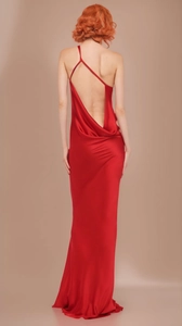 Detail of elegant backless satin red evening gown with crisscross straps and floor length