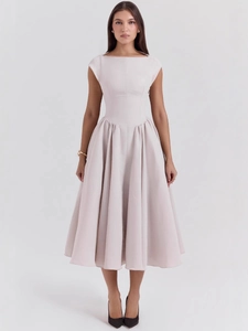 Elegant backless sleeveless maxi dress in light nude pink with pleated flared skirt