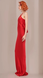 Elegant red satin evening gown featuring a halter neck and backless detail with a slim fit