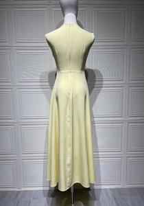 Detailed back view of a minimalist sleeveless yellow maxi dress with invisible zipper