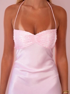 Pink sequin satin halter dress featuring backless tie design and slim fit silhouette