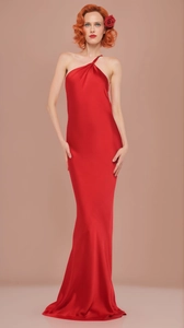 Close-up of premium red satin evening gown featuring elegant draped neck and glossy texture