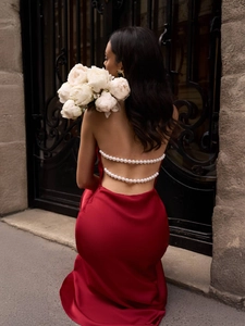 Elegant backless burgundy satin maxi dress with luxurious pearl straps and v-neckline