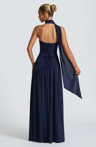 Detail of dark blue strapless gown showing back lace-up design and long neck scarf