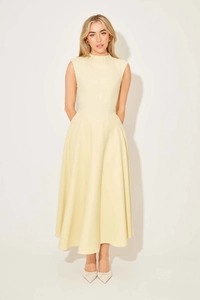 Detail of elegant cream sleeveless midi dress with high neck and flowing A-line silhouette