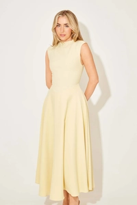 Close-up of cream sleeveless maxi dress showing premium fabric and sleek A-line cut
