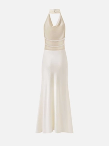 Detail view of champagne satin backless dress with elegant double-layer pearl chain decor