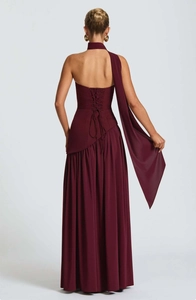 Detail of burgundy evening gown showing crisscross back lace-up and elegant ruffles