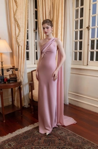 Detail of elegant pale pink satin gown with unique one-shoulder pleated neckline and long sash
