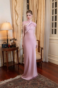 Close-up of pink satin dress neck detail showing elegant crossover halter design