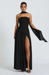 Detail of elegant black strapless maxi dress with side slit and matching neck scarf