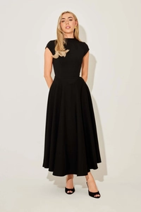 Detail of elegant black slim fit maxi dress featuring a high neck and cap sleeves