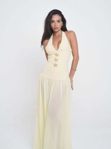 Elegant pale yellow halter maxi dress with golden starfish details and draped skirt