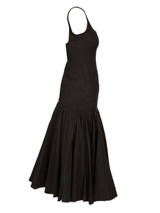 Detail of a black halter fishtail gown with slim fit and flared hem on white background